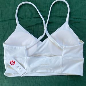 Manduka sports bra in white with tag, size L